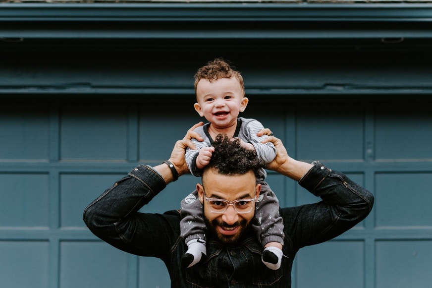father and son smiling for photo