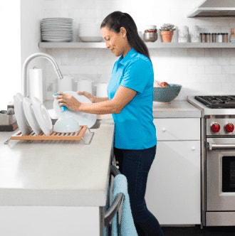 A woman doing dishes.