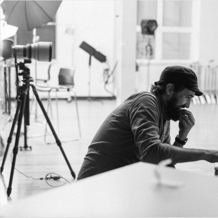 A man making art in an art studio.