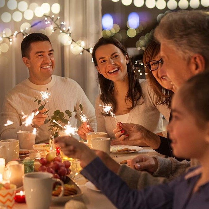 friends and family at a holiday dinner table.