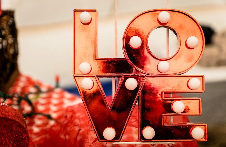 a light up sign that reads 'Love'